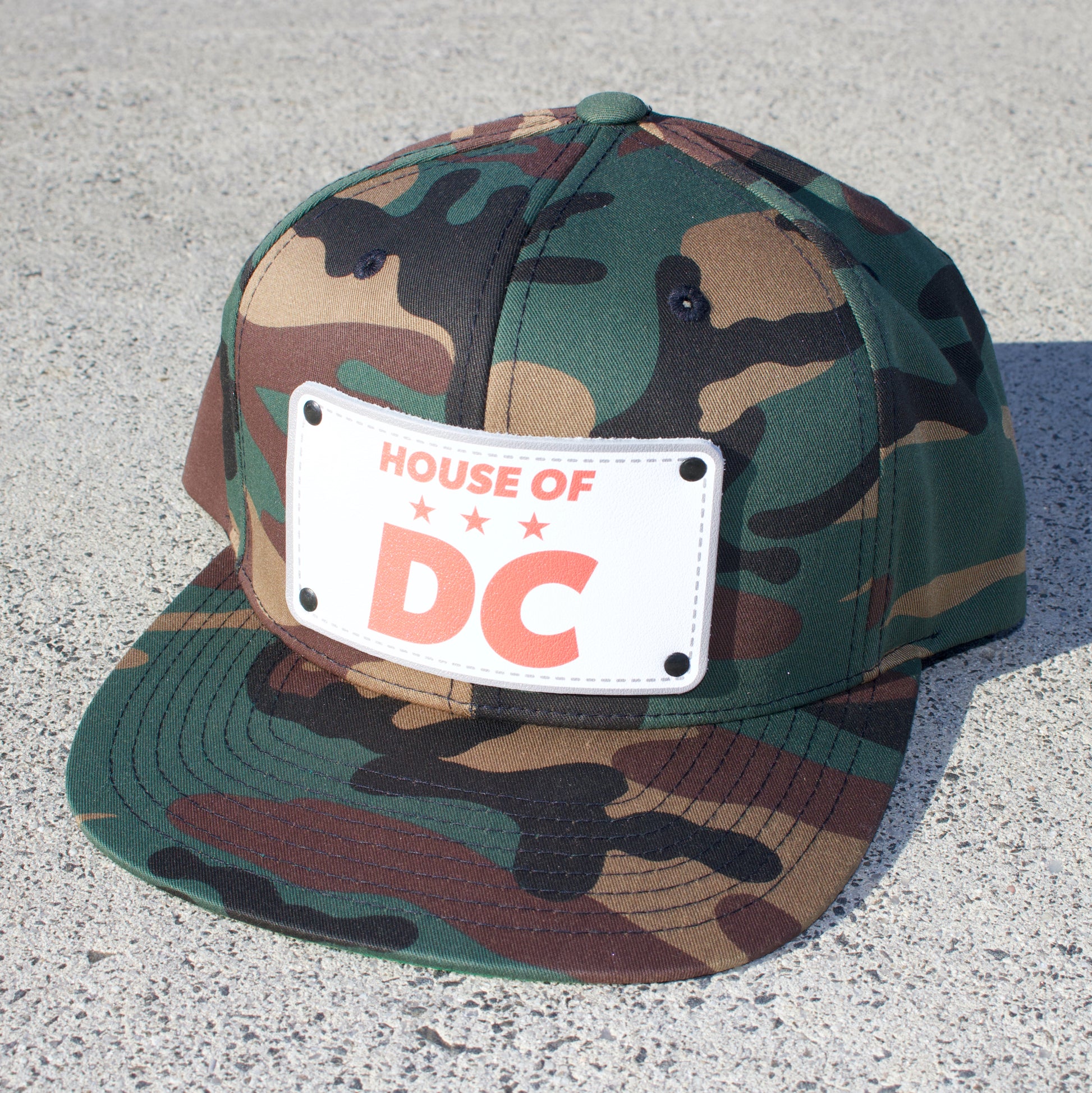 picture of camouflage ht with HOUSE OF DC logo
